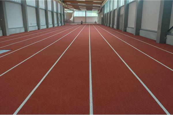 Retopping atletiekpiste indoor - Sportinfrabouw NV